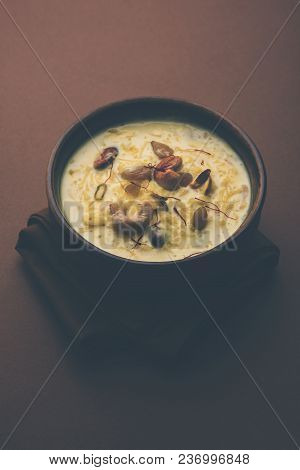 Kheer Or Rice Pudding Is An Indian Dessert In A Brown Terracotta Bowl With Dry Fruits Toppings