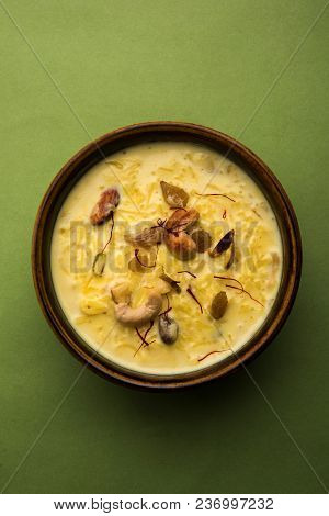 Kheer Or Rice Pudding Is An Indian Dessert In A Brown Terracotta Bowl With Dry Fruits Toppings