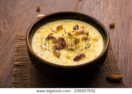 Kheer Or Rice Pudding Is An Indian Dessert In A Brown Terracotta Bowl With Dry Fruits Toppings