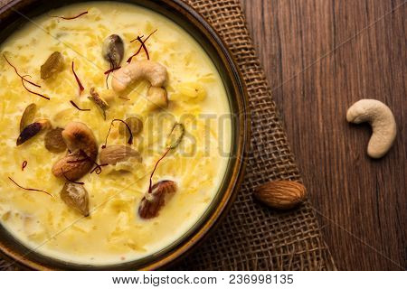 Kheer Or Rice Pudding Is An Indian Dessert In A Brown Terracotta Bowl With Dry Fruits Toppings