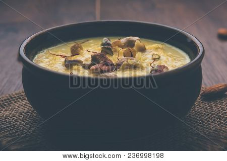 Kheer Or Rice Pudding Is An Indian Dessert In A Brown Terracotta Bowl With Dry Fruits Toppings
