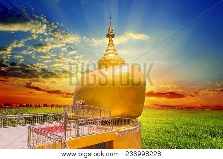 The Replica Of Phra That In-kwaen (hanging Golden Rock) With Sunset Background, At Koh (islands) Sir