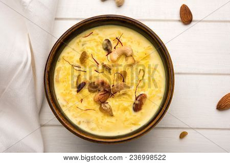 Kheer Or Rice Pudding Is An Indian Dessert In A Brown Terracotta Bowl With Dry Fruits Toppings