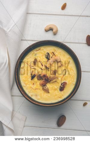 Kheer Or Rice Pudding Is An Indian Dessert In A Brown Terracotta Bowl With Dry Fruits Toppings
