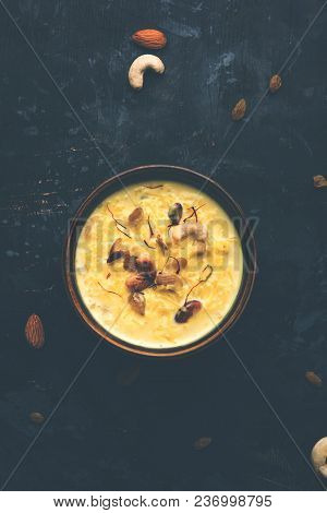 Kheer Or Rice Pudding Is An Indian Dessert In A Brown Terracotta Bowl With Dry Fruits Toppings