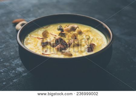 Kheer Or Rice Pudding Is An Indian Dessert In A Brown Terracotta Bowl With Dry Fruits Toppings