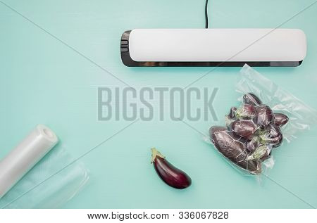 Plastic Sealing Machine. Vacuum Packaging Of Fresh Tomatoes. Vacuum Packaging Fresh Eggplant For Sto