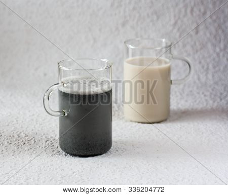 White And Black Sesame Milk, Alternative Milk, Vegan Milk On Gray Background