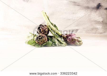 Artichokes On Grey Background. Fresh Raw Organic Artichoke Flower.