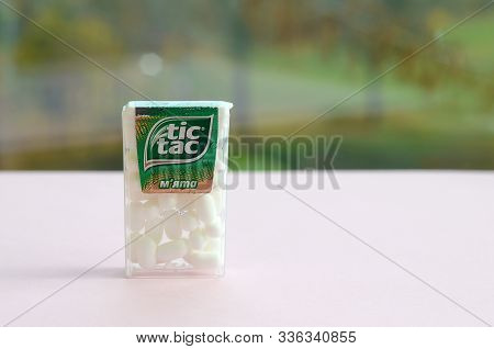 Many Tic Tac Candy Packages On Green Wood Background. Tic Tac Is Popular Due Its Minty Fresh Taste A