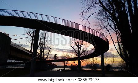 Düsseldorf, 9 January 2018 - Silhouette Of A Man Riding A Bike On A Bridge (theodor-heuss-brücke). I