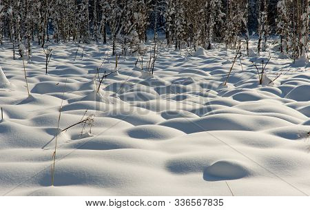 Russia. Mountain Altai. Texture Relief Of Hummocks On A Swamp Covered With Snow In Late Late Autumn.