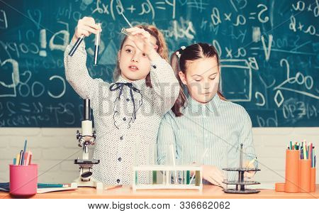 Little Kids Learning Chemistry. Chemistry Equipment. Students Do Biology Experiments With Microscope