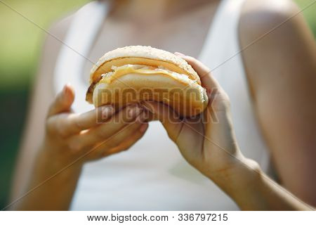Cute And Stylish Girl With A Humburger