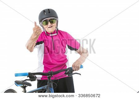 Old Biker Woman In A Helmet And Pink Shirt