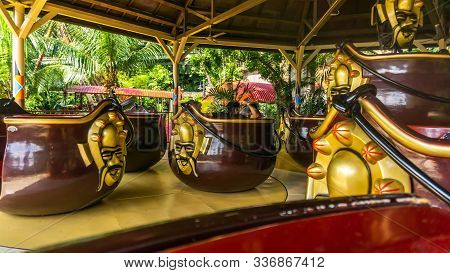 Unidentified Male Tourist Enjoyed Riding And Spinning At The Apache Pots At Sunway Lagoon Theme Park