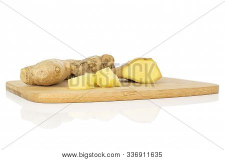 Group Of One Whole Two Slices One Piece Of Fresh Brown Ginger On Bamboo Cutting Board Isolated On Wh