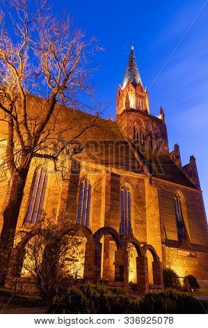 Trzebiatow, Zachodniopomorskie / Poland – November, 30, 2019: Church Illuminated By Spotlights At Ni