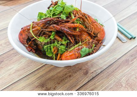 Chongqing Sichuan Spicy Dried Chilli Small Lobsters, Among Other Dishes In The Background. Food Phot