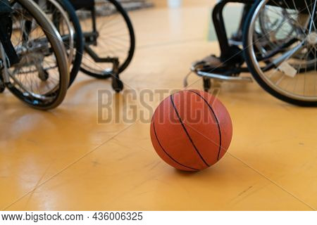 a photo of the wheelchair, wheelchair equipment and ball located in the arena before the game