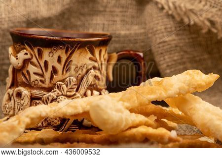 Fried Bread Sticks With Salt And A Ceramic Mug, Close-up, Selective Focus