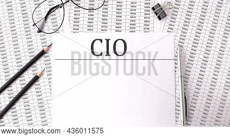 Paper With Cio- Chief Investment Officer On A Table On The Charts
