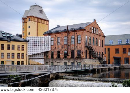 Norrkoping, Sweden - July 27, 2021: Beautiful Cityscape With Old Industrial Buildings And Water Rese