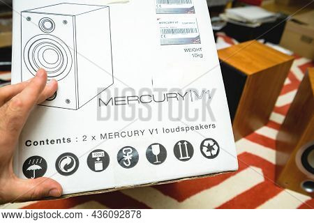 Paris, France - Jun 14, 2021: Pov Male Hand Pointing At The Tannoy Mercury V1 Loudspeaker Package Du