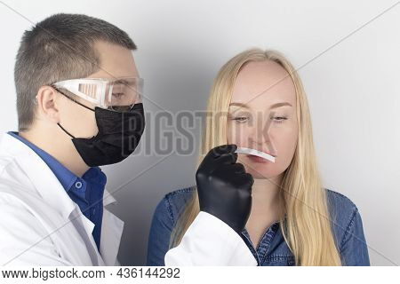 The Girl Complains To The Doctor About The Loss Of Smell. The Doctor Conducts A Sense Of Smell Test.