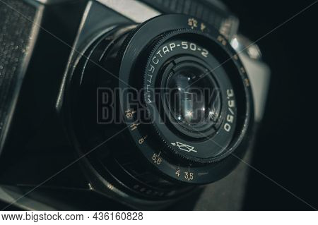 Close-up Of The Soviet Manual Lens Industar 50-2 On A Film Camera Zenit-e. Black Background, Selecti