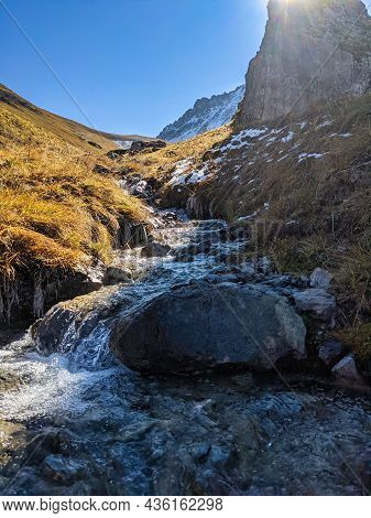 Small Mountain Stream, River In The Swiss Mountains Near Davos Monstein In The Canton Of Graubunden.