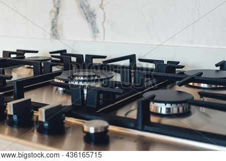 Kitchen Gas Stove, Close Up. New Gas Stove Appliance And Countertop Surface At Modern Kitchen. Moder
