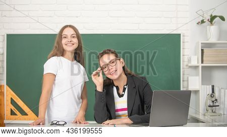 Cheerful Woman Teacher And Child In Classroom, Knowledge Day