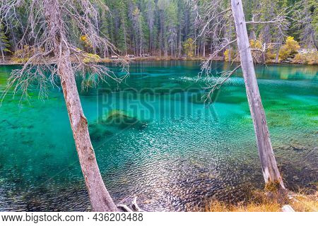 Canmore, Alberta, Canada - 28 September 2021: Grassi Lake In The Southern Canadian Rockies Overlooki