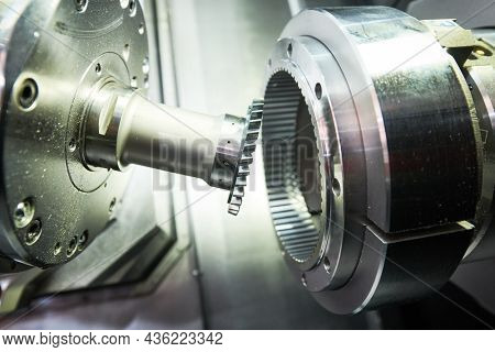 gear skiving operation on cnc machine in metalworking industry. Cutting tool makes internal tooth with mill