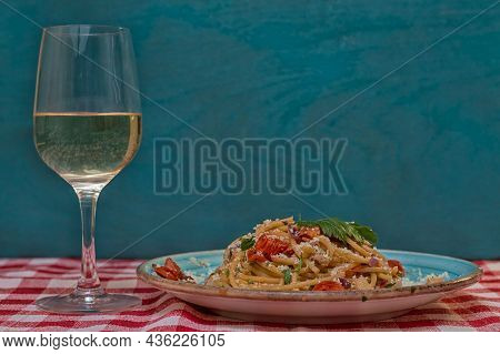 Spaghetti Allamatriciana Glass Of White Wine Blue Plate