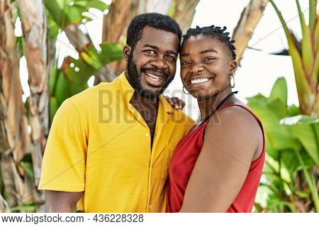 Young afircan american couple smiling happy and hugging at the city.
