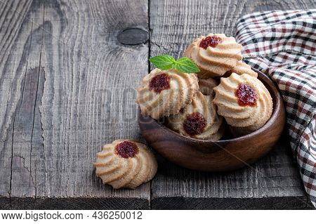 Qurabiya  Cookie Shortbread With Jam On Rustic Wooden Table