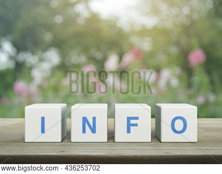 Info Letter On White Block Cubes On Wooden Table Over Blur Pink Flower And Tree In Garden, Business 