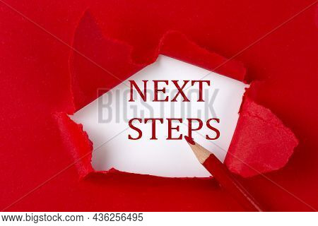 Next Steps Text On Red Torn Paper With Red Pencil