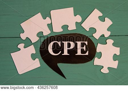 Cpe - Acronym On A Black Note On A Green Background With Puzzles.
