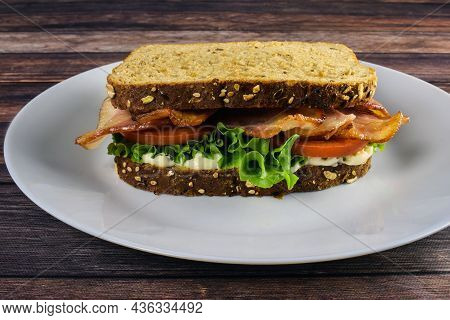 Bacon Lettuce  And Tomato Between Whole Grain Bread,
