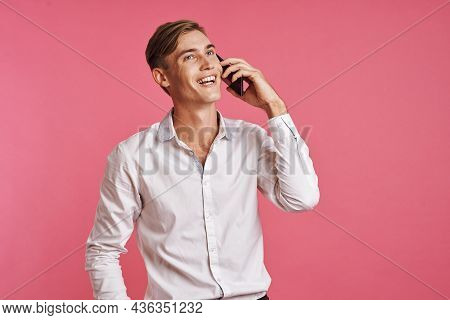Businessmen In A White Shirt Talking On The Phone Pink Background