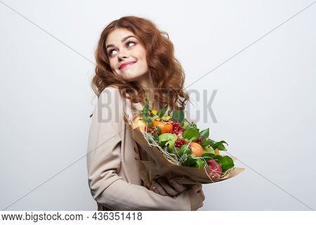Portrait Of A Woman Fun Posing Fruit Bouquet Vitamins Light Background
