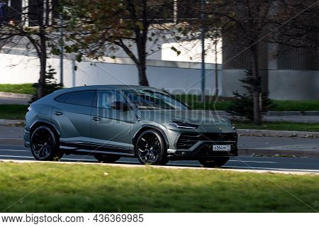 Moscow; Russia - October 14; 2021: Gray Lamborghini Urus  Is Driving Fast On The Street On A Warm Au