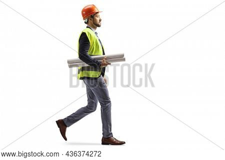 Site engineer with a safety equipment walking and carrying blueprints isolated on white background