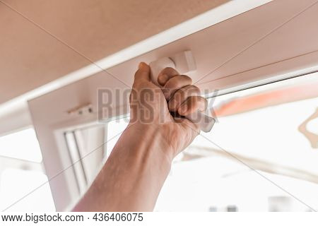 The Guy's Hand Opens A Plastic Double Window For The Handle Pvc Double Glazing.