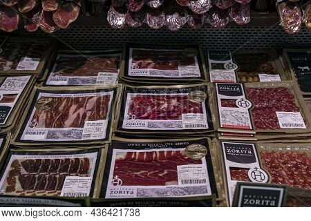 Pamplona, Spain - June 22, 2021: Packaged Sliced Serrano Iberico Ham For Sale At A Local Shop