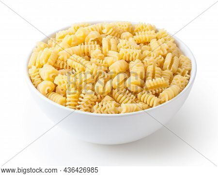 Uncooked Radiatori Pasta In White Ceramic Bowl Isolated On White Background With Clipping Path