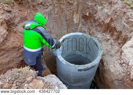 Installation of underground tank for sewage system.